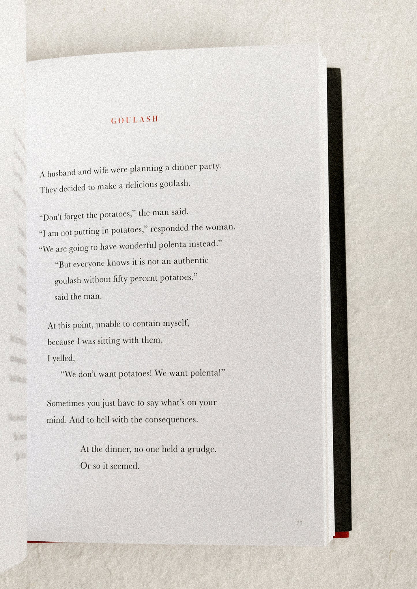 Open book with a humorous story on a textured surface