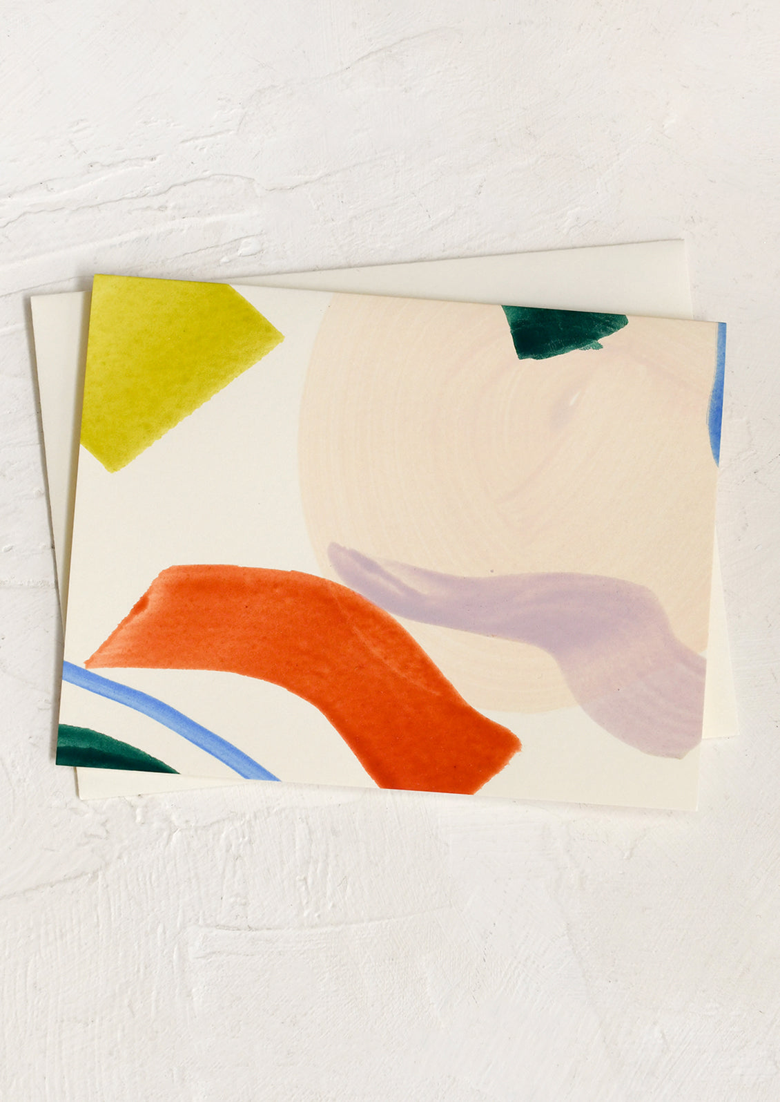 A set of blank greeting cards with colorful abstract pattern on front.