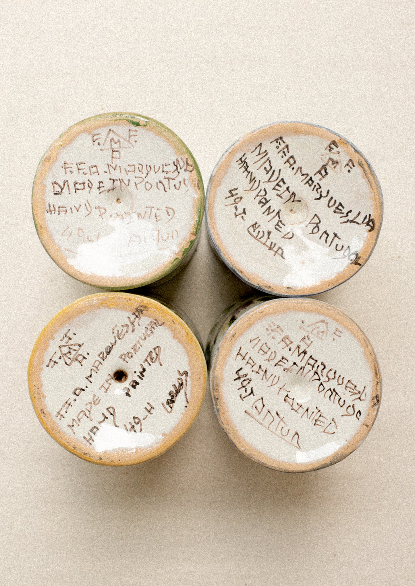 A set of four floral painted wine glasses.