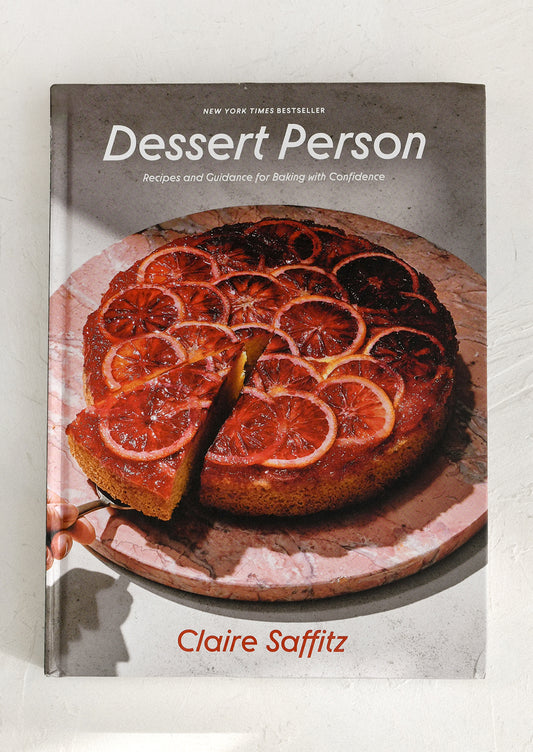 Book titled 'Dessert Person' by Claire Saffitz with a cake on the cover.