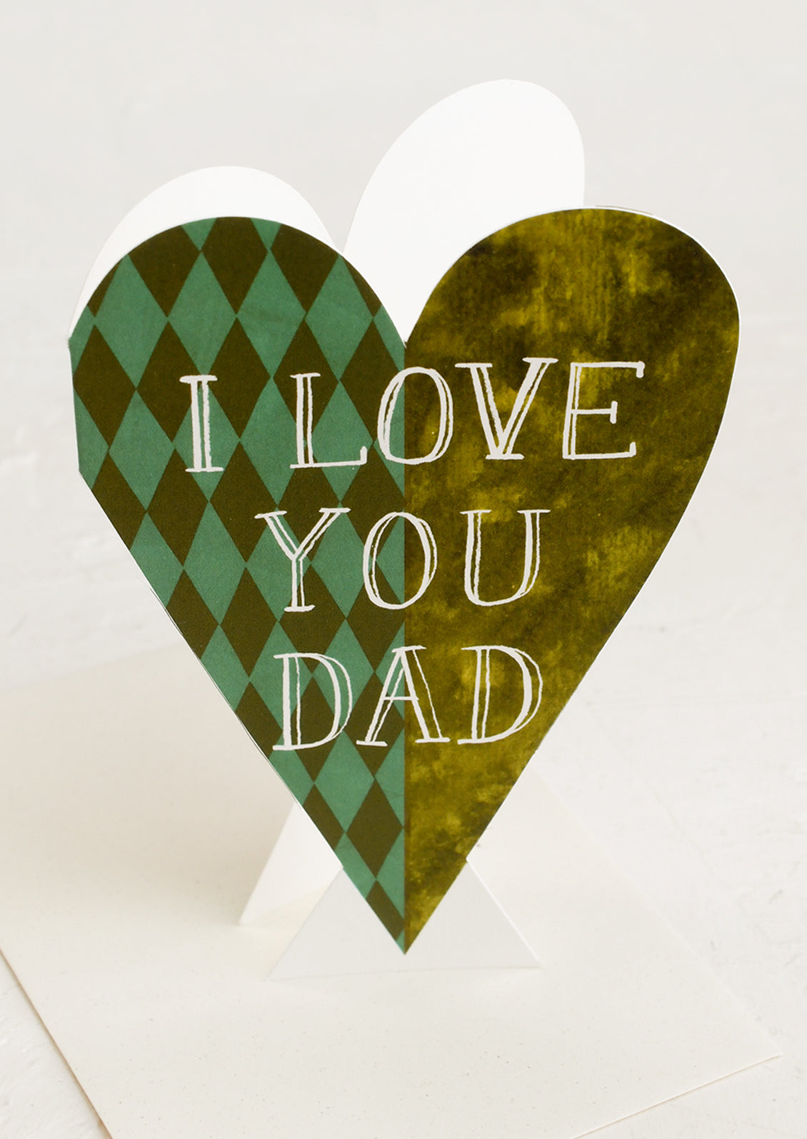 Heart-shaped card with 'I Love You Dad' text on a white background