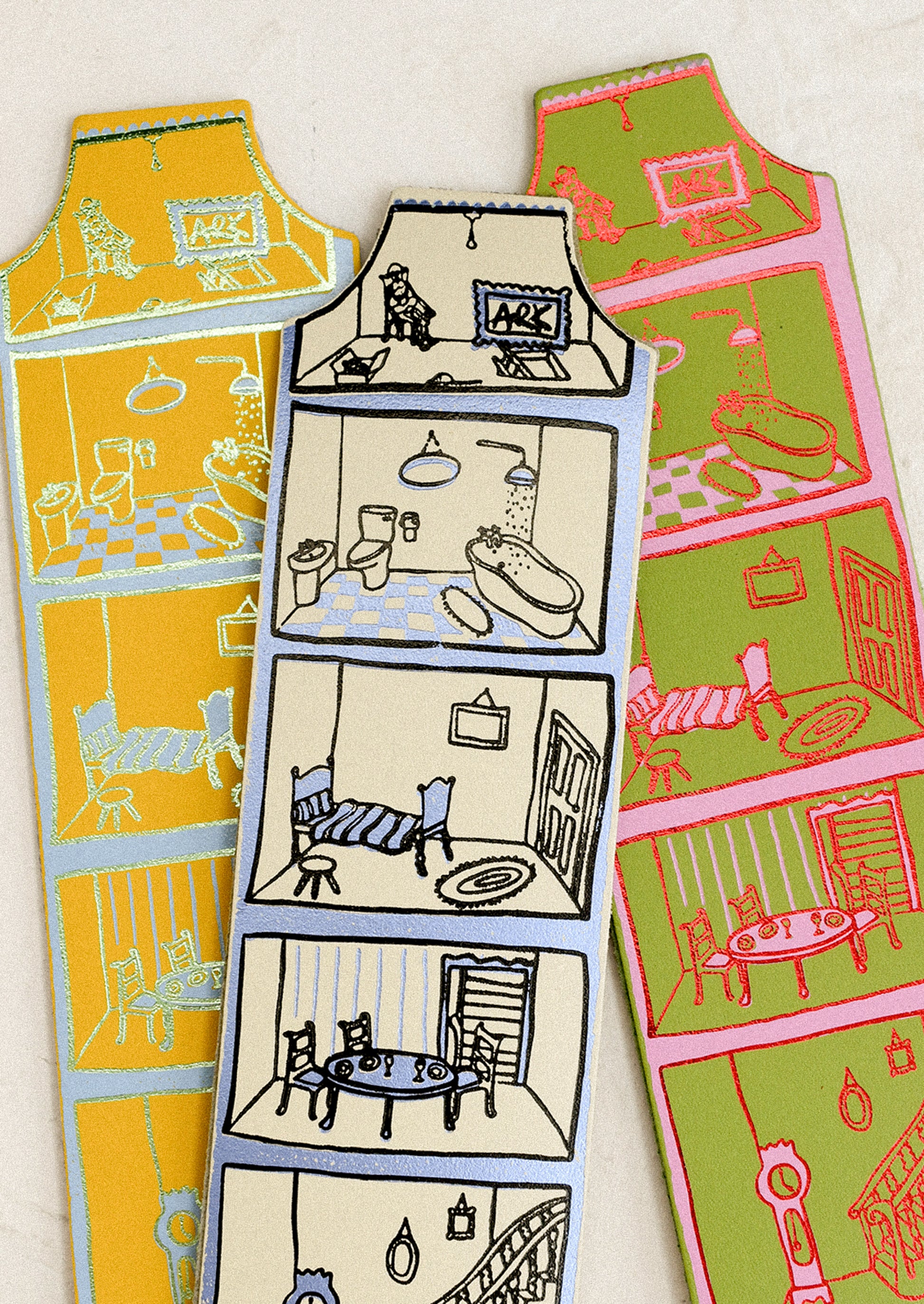 Colorful bookmarks with illustrated room designs on a white background