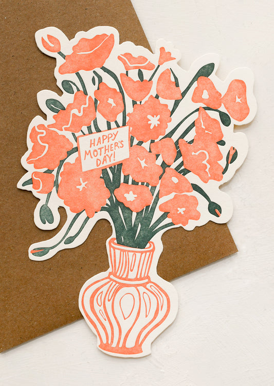 Card of a bouquet of flowers with a 'Happy Mother's Day' card in a vase on a brown background.