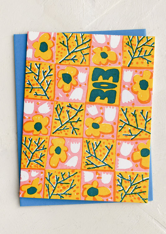 Colorful floral patterned card with blue border on a white background