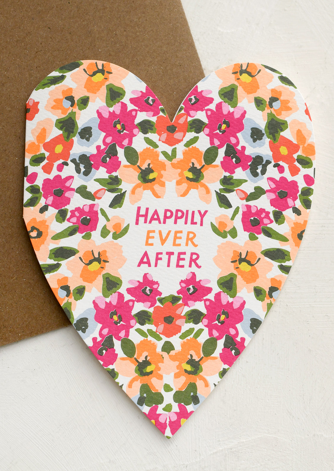 Heart-shaped card with floral design and 'Happily Ever After' text on a white background