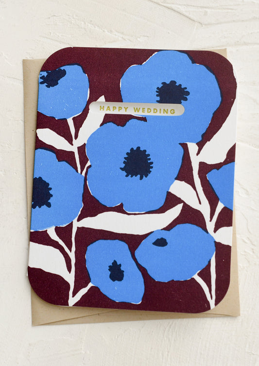 Card with blue floral design and 'Happy Wedding' text on a white background