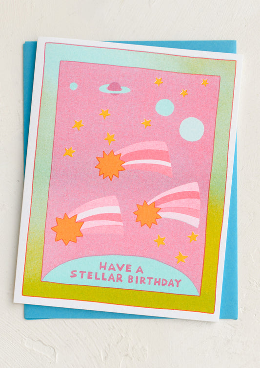 Greeting card with space-themed design and 'Have a stellar birthday' text on a white background.