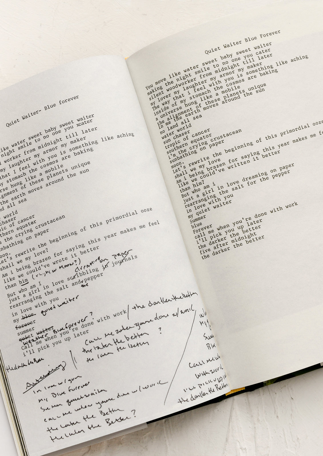 Open book with handwritten text on a light background