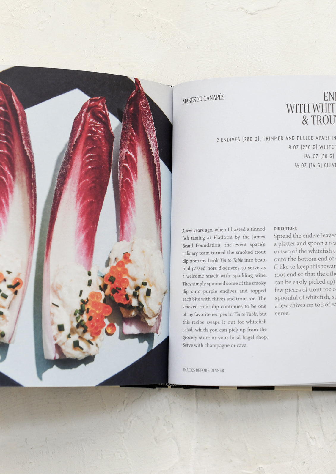 Open cookbook showing a recipe with images of food items on a white background