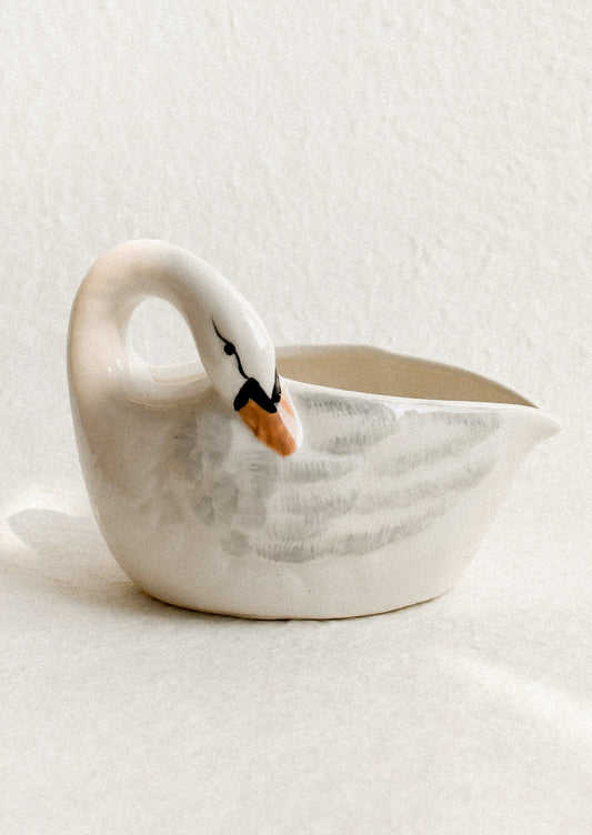 Ceramic swan-shaped bowl on a light background