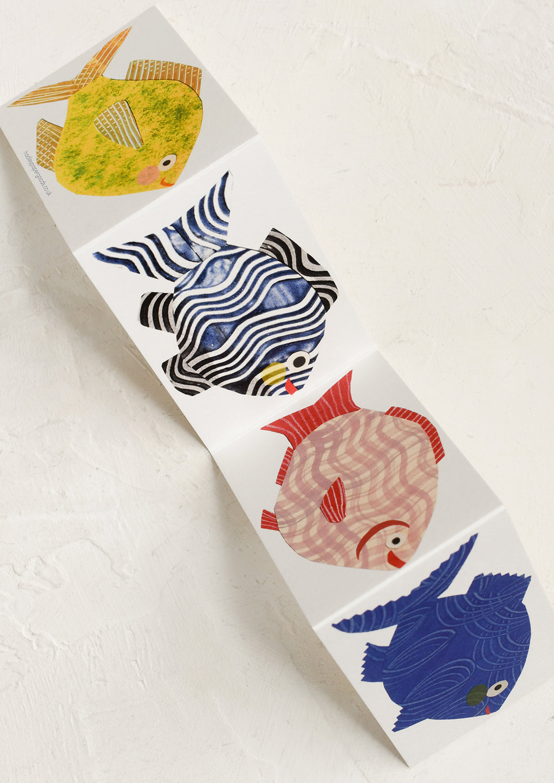 Set of colorful fish-shaped stickers on a white background