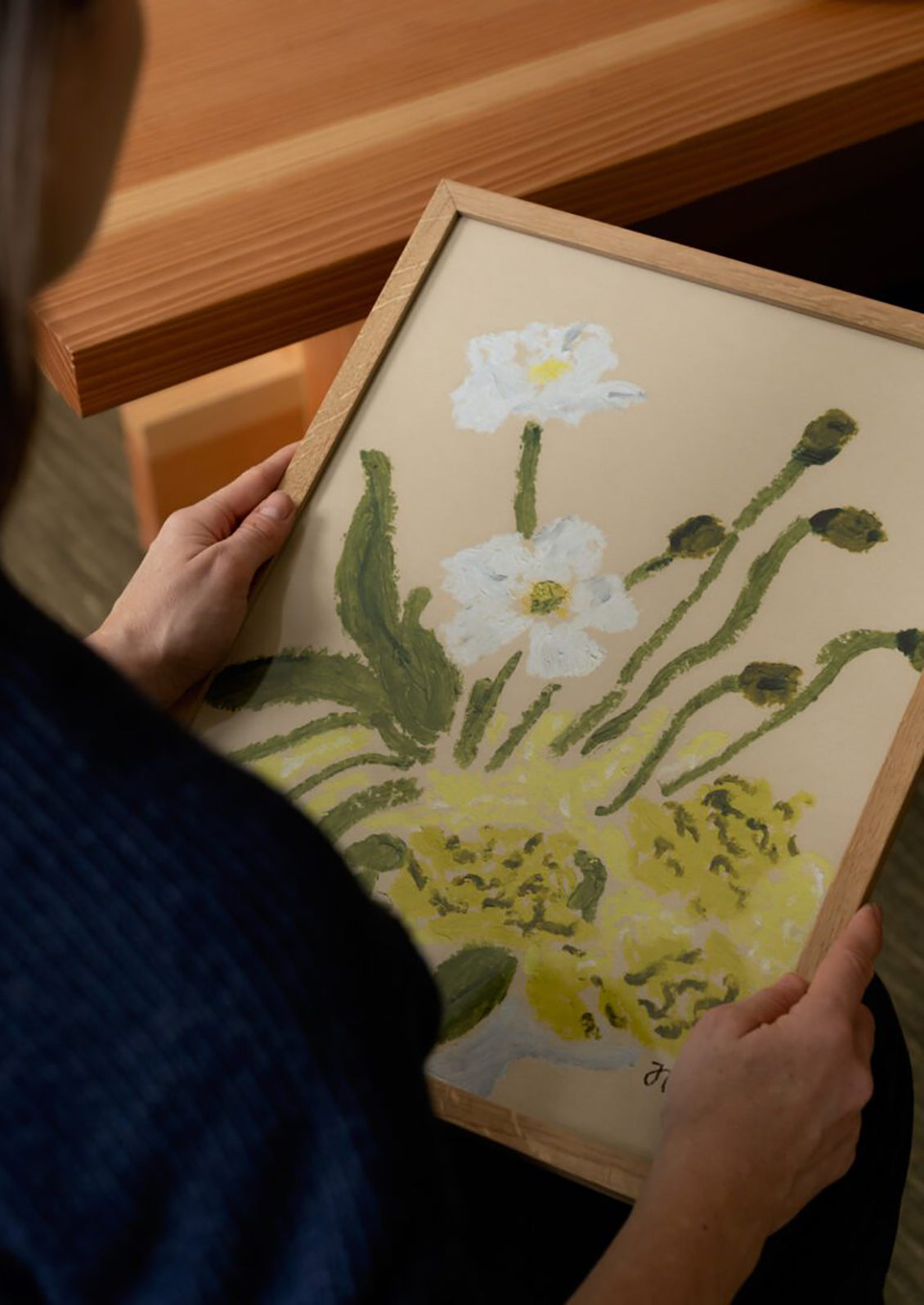 An art print of a pastels painting of white and green floral arrangement.