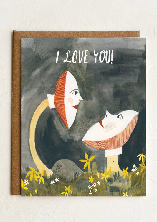 A card with whimsical illustration of mushrooms with faces, text reads I love You!