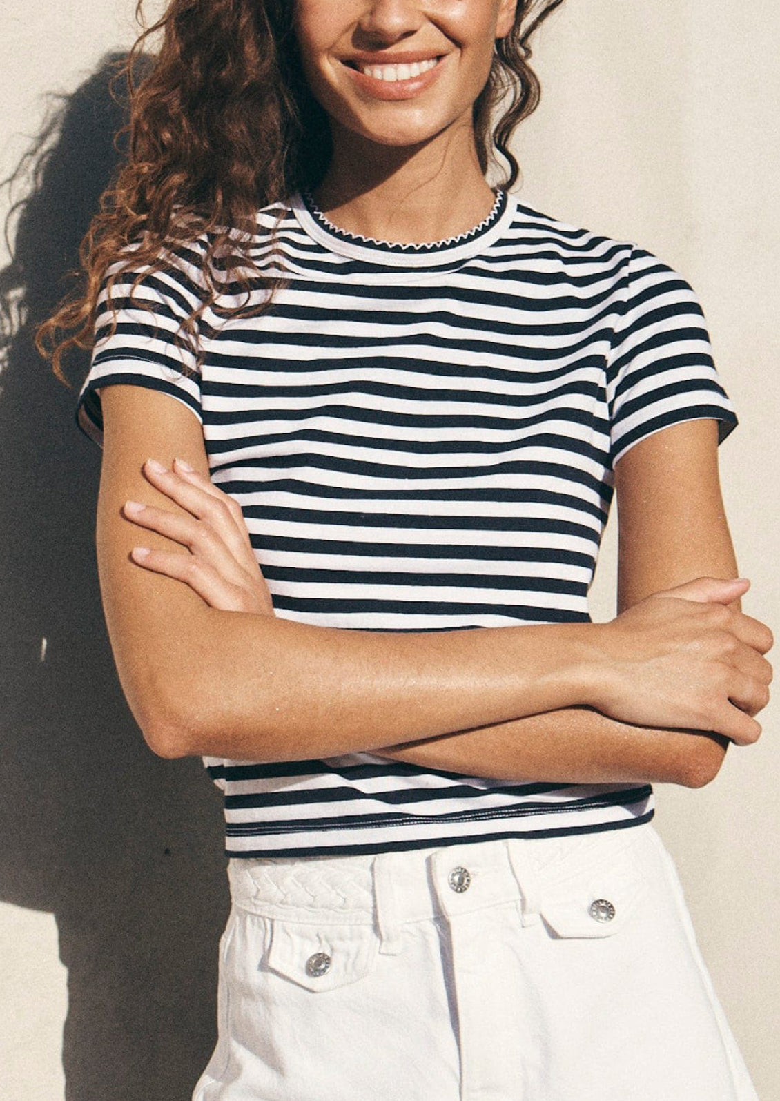 A striped short sleeve t-shirt in navy and white stripes.