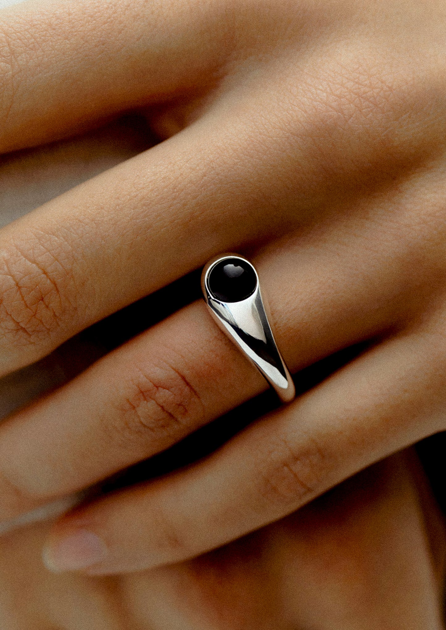 A high polish ring with onyx stone.