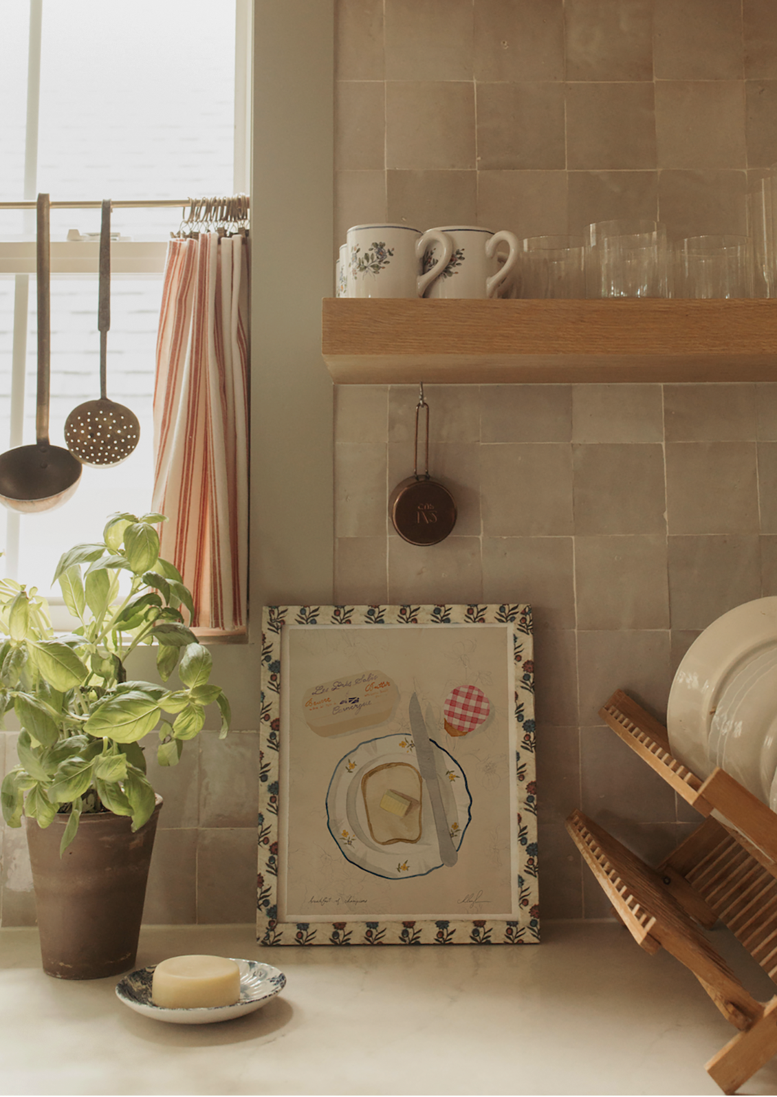 An art print of an illustration of a piece of toast on a plate with butter and jam.
