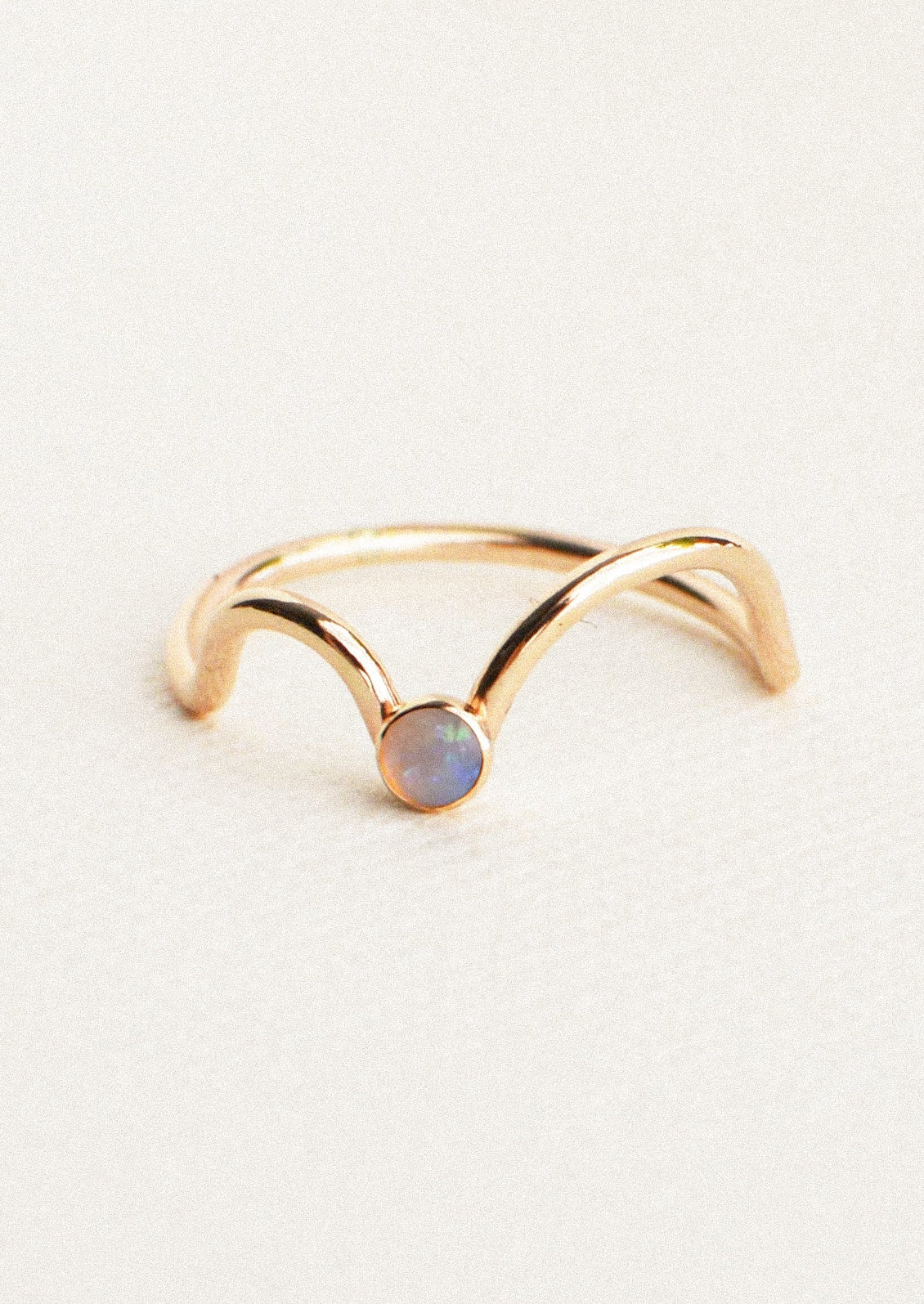A gold ring with an Australian opal gem.