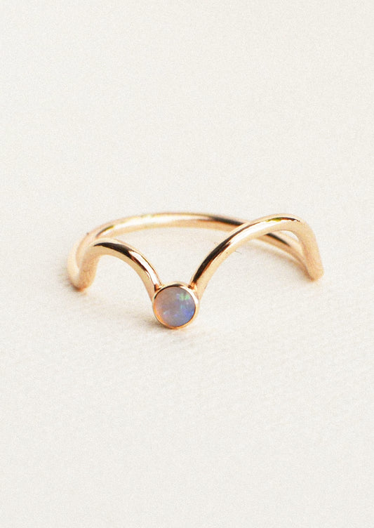 A gold ring with an Australian opal gem.