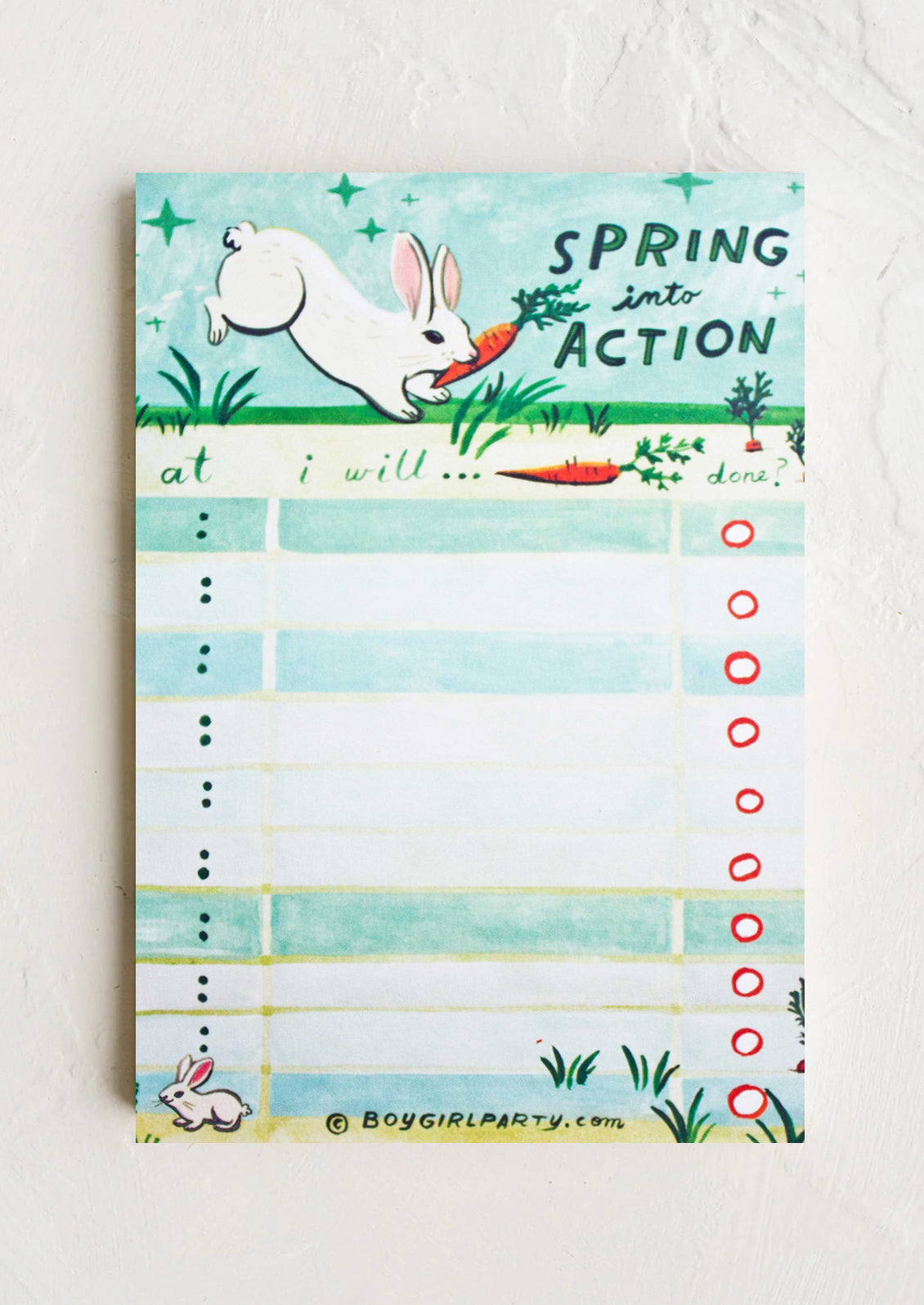 Notepad with a spring-themed design featuring a rabbit and carrots on a light blue background.