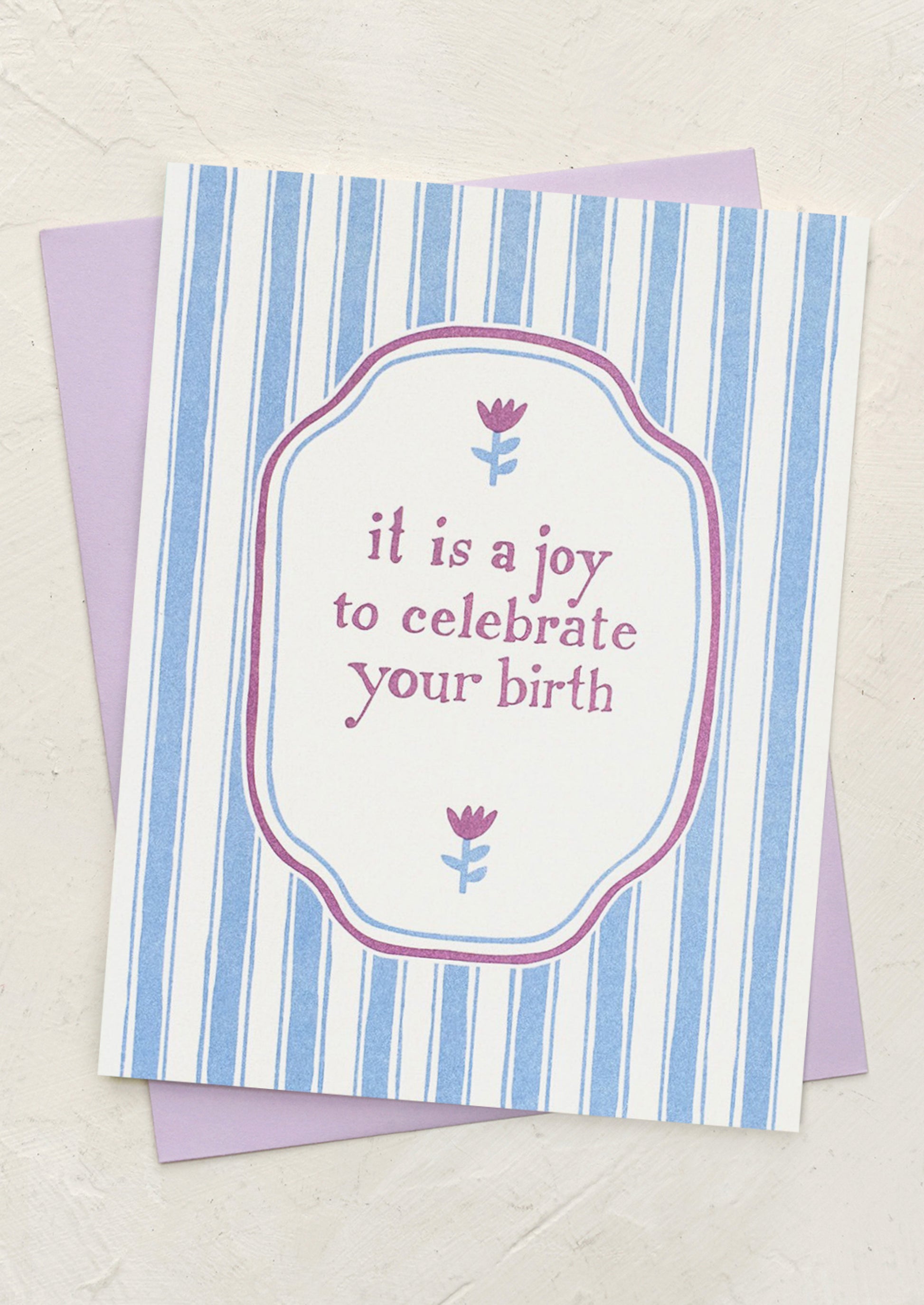 A striped card reading "It is a joy to celebrate your birth".