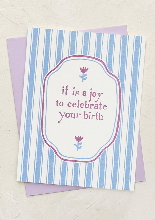 A striped card reading "It is a joy to celebrate your birth".
