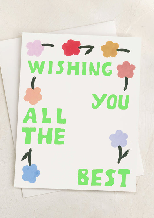 A card with flower print, neon green text reads "Wishing You All The Best".