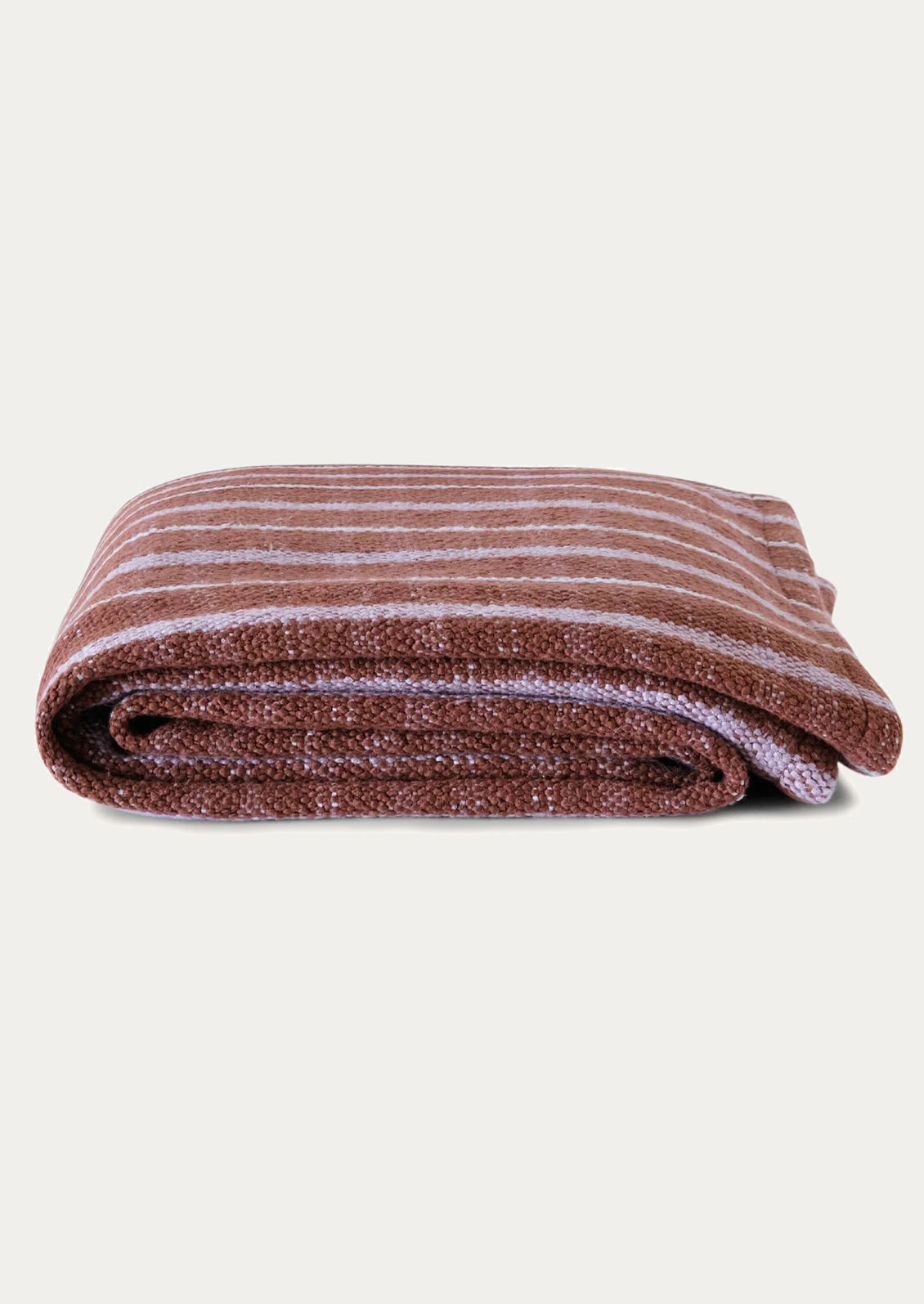 Folded striped blanket with brown and lilac hues.