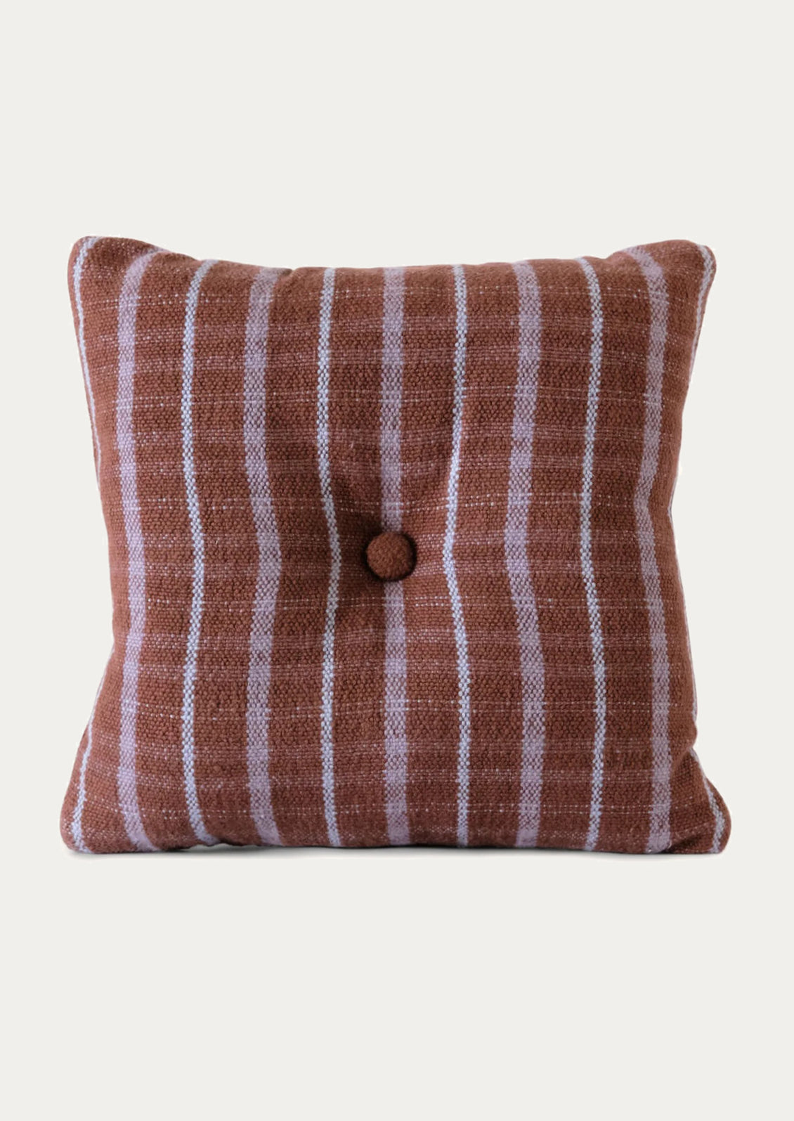 A brown and purple striped cotton pillow with tufted button detail at center.