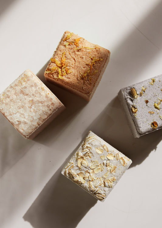 Four bath cubes in assorted colors.