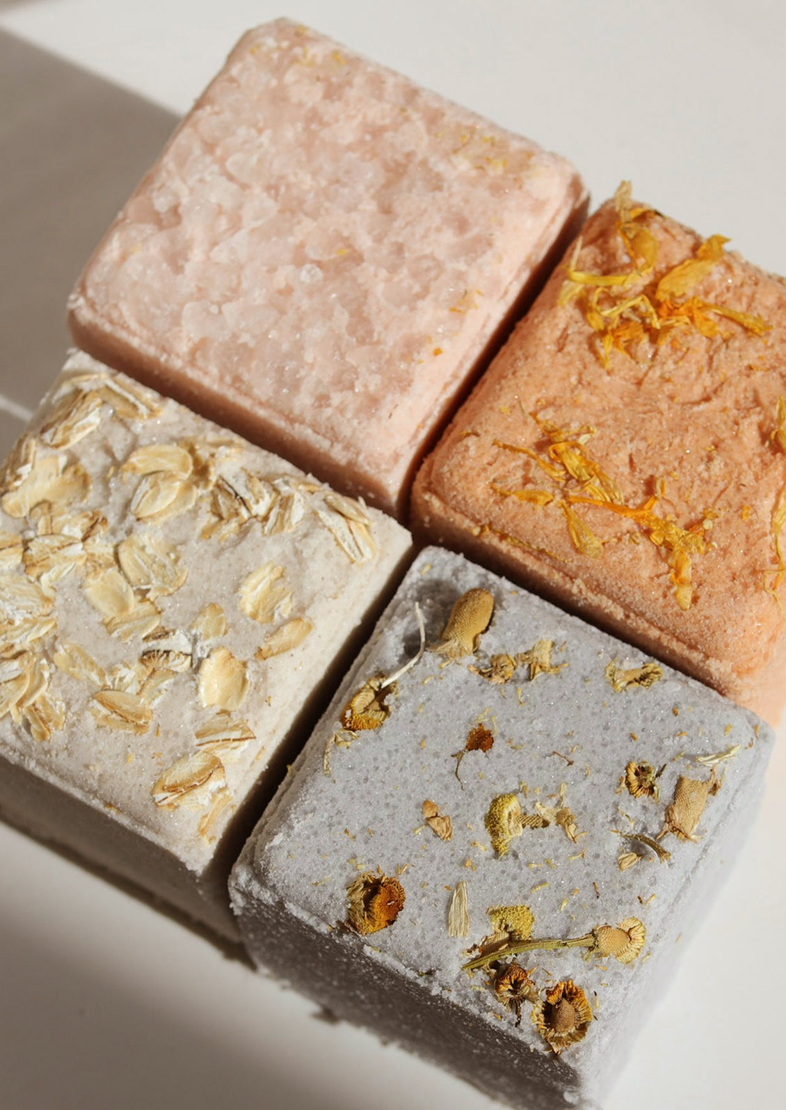 Four bath cubes in assorted colors.