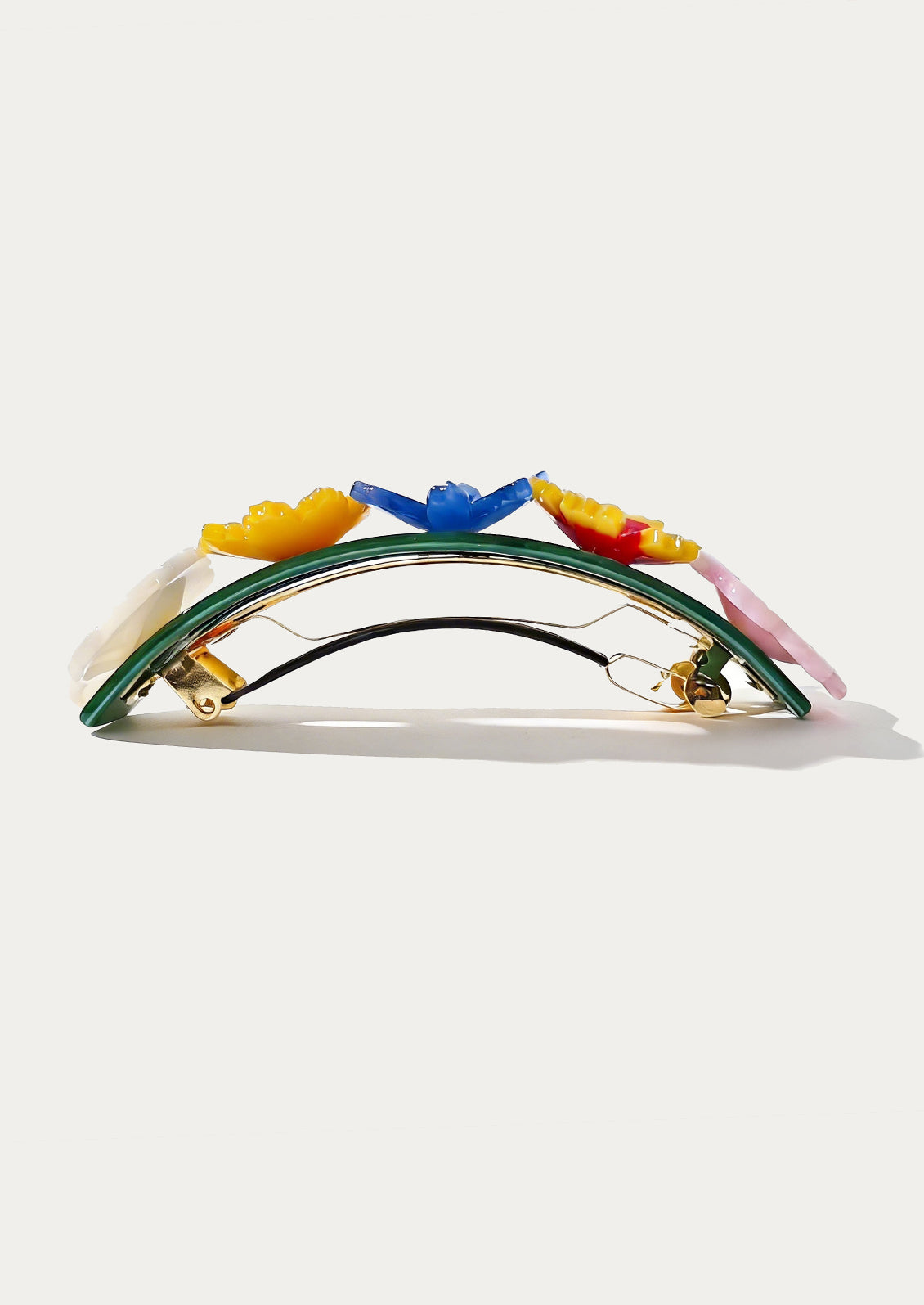 Colorful hair clip with bird designs on a white background