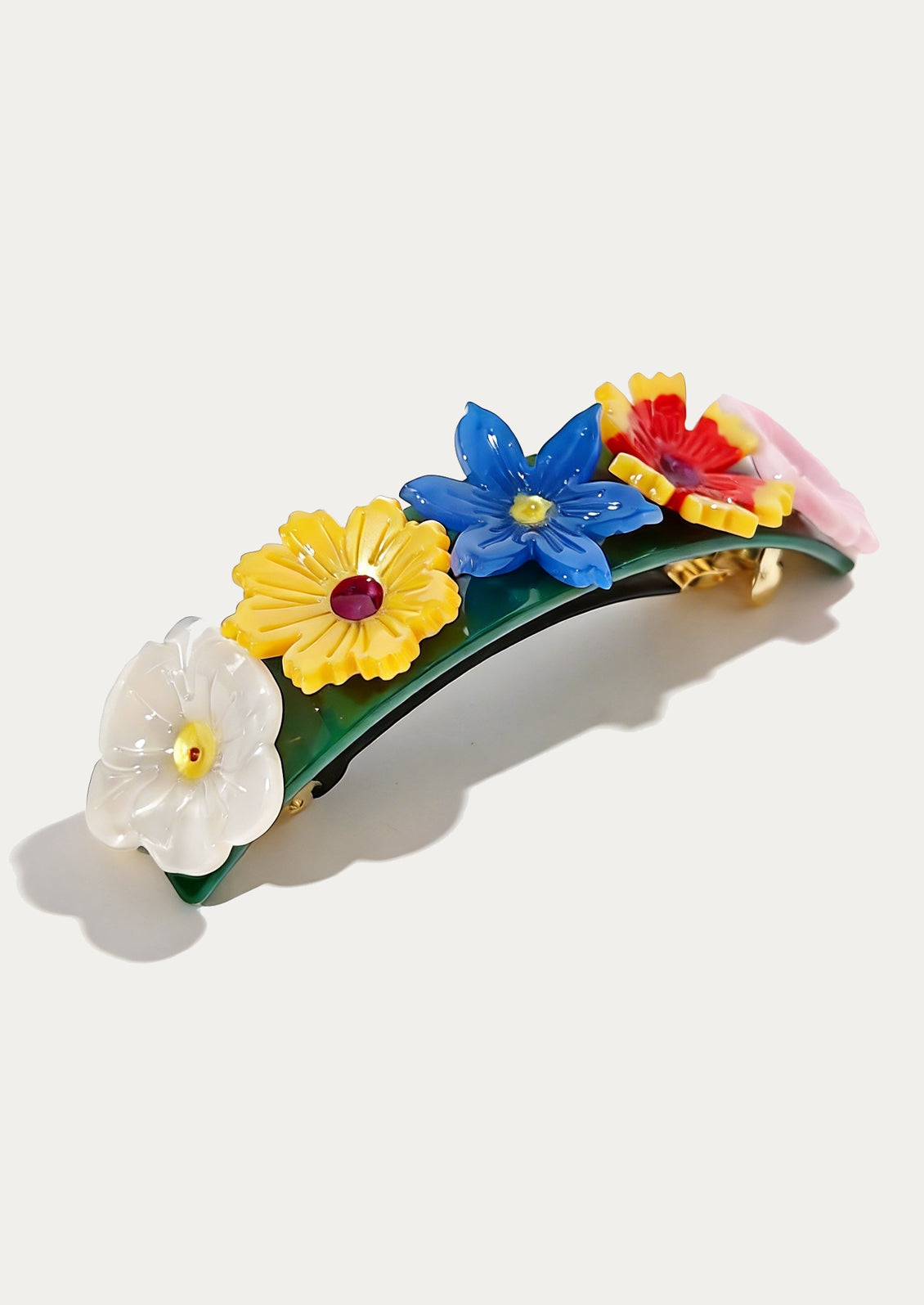 Colorful floral hair clip on a white background