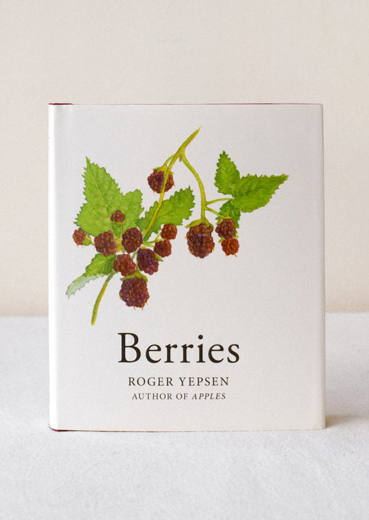 A small hardcover book titled "Berries" with raspberry illustration.