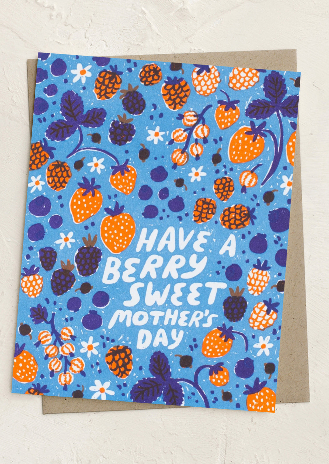 Greeting card with berry pattern and 'Have a berry sweet Mother's Day' text on a blue background.