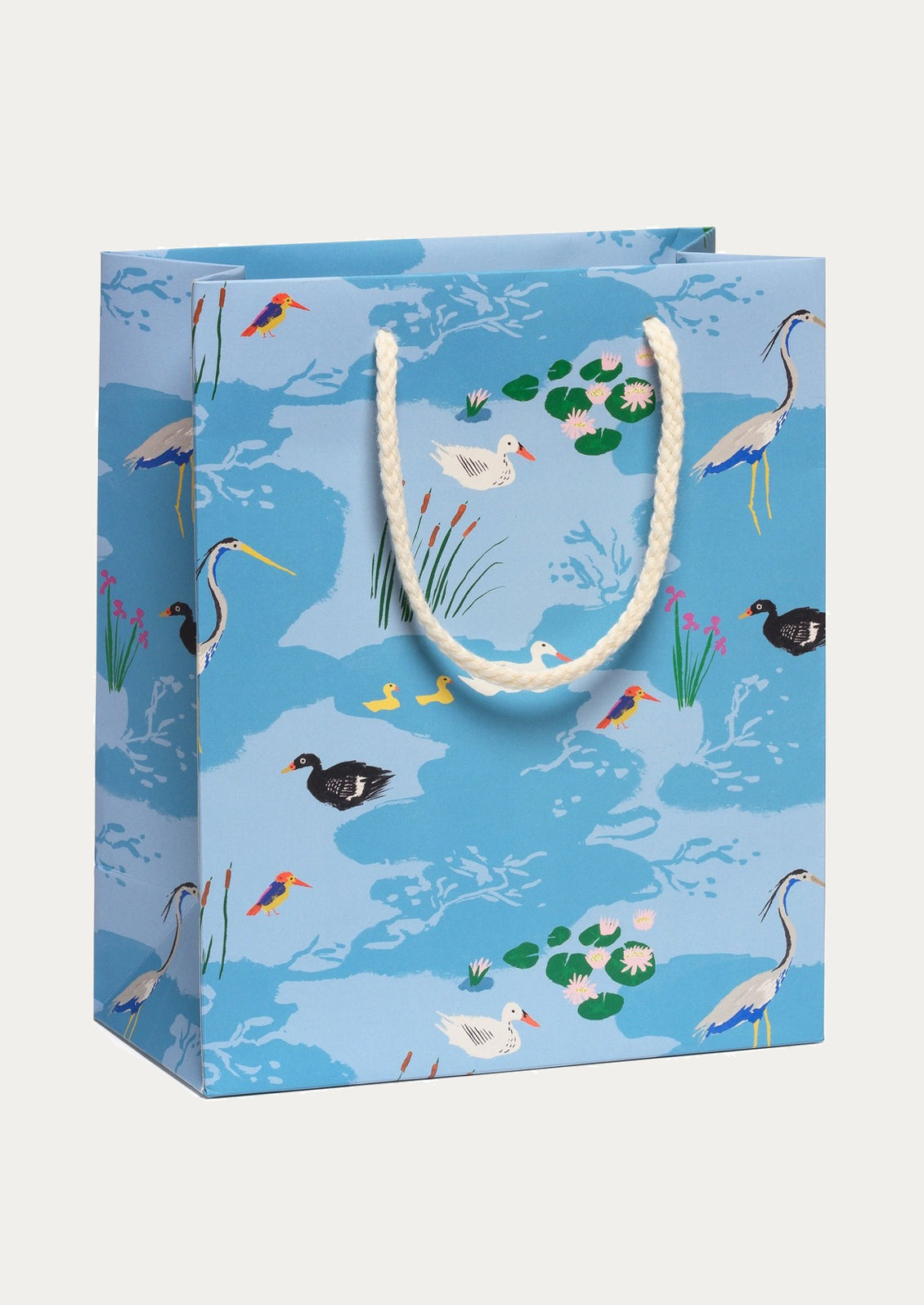 Gift bag with bird and nature pattern on a blue background