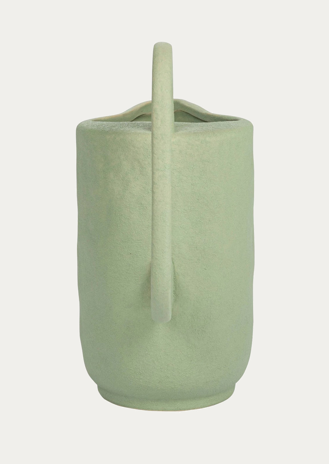 Mint green ceramic pitcher with exaggerated, sculptural shape.