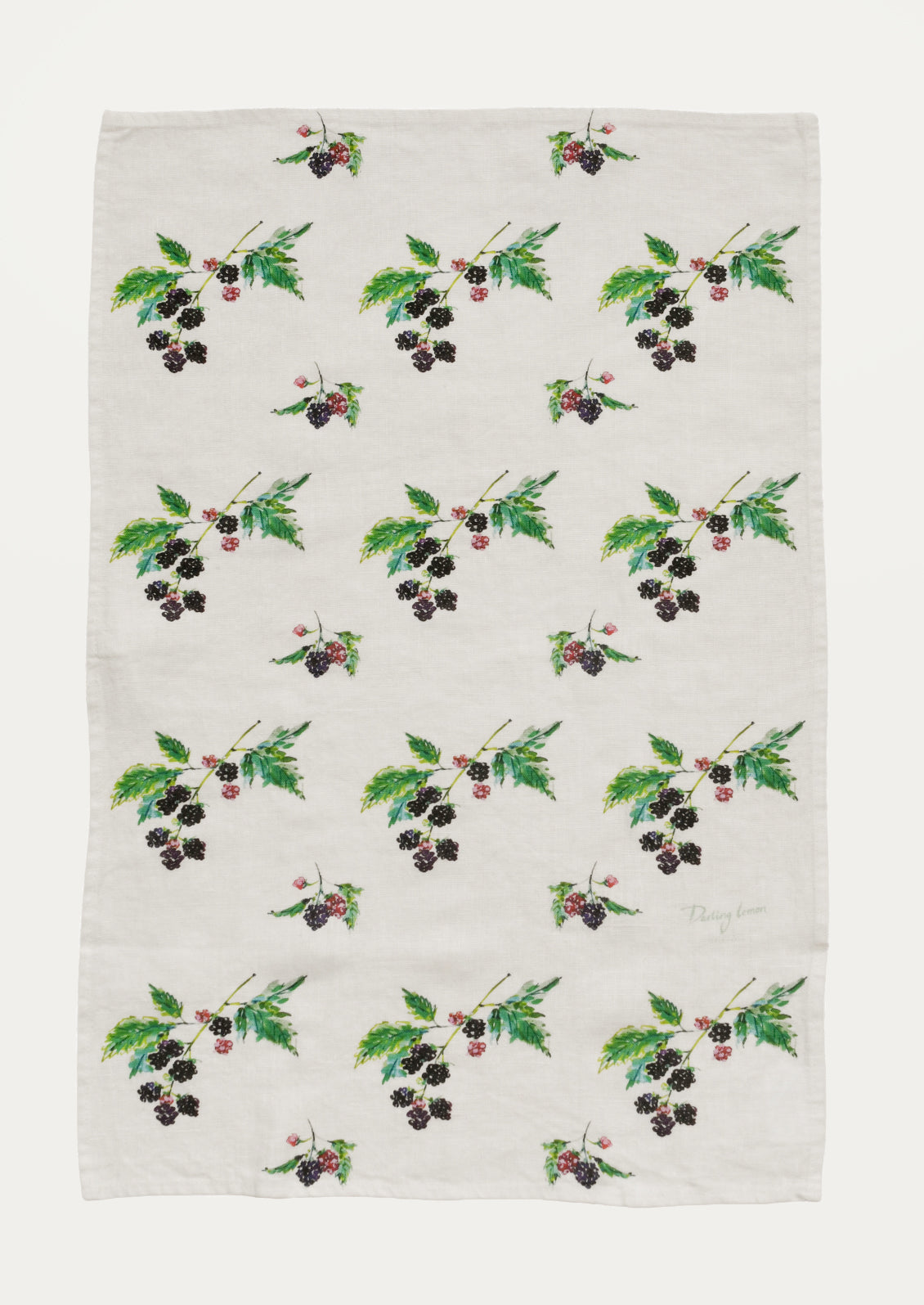Patterned fabric with blackberry and leaf design on a white background