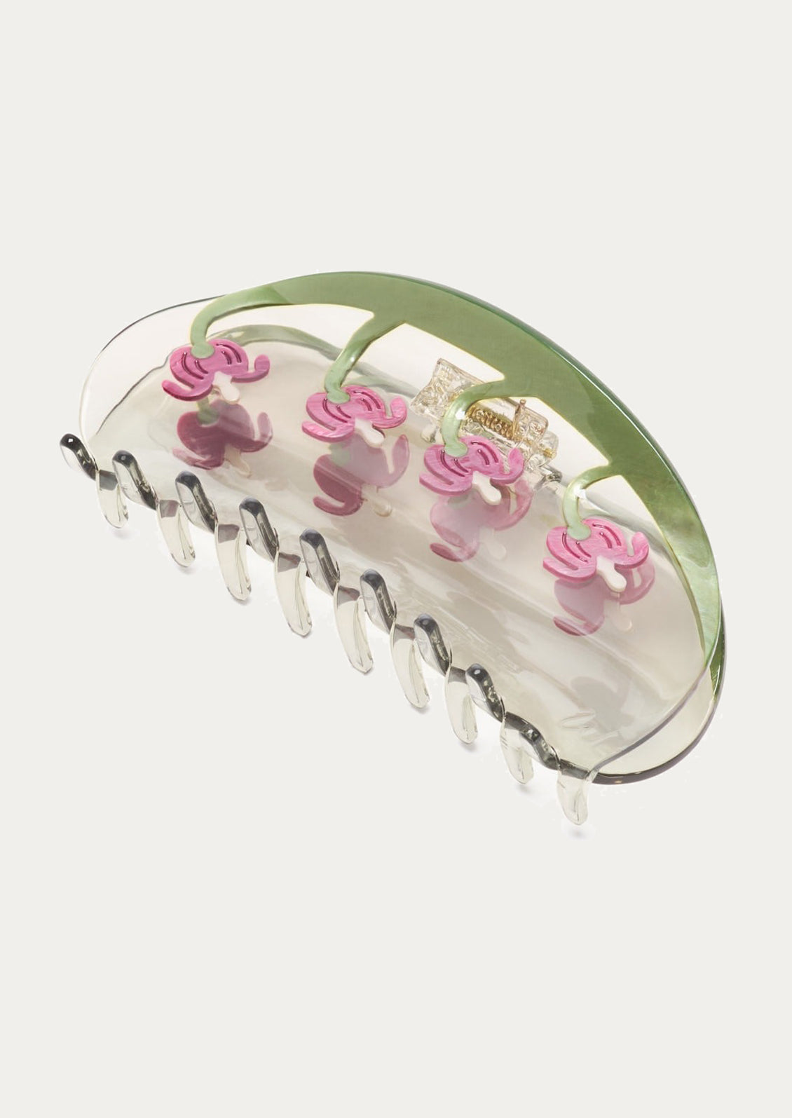 Hair clip with pink floral design on a white background