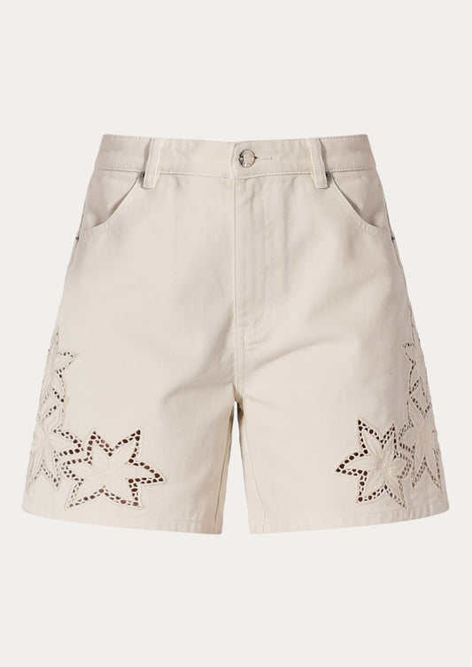 Beige shorts with star patterns on a white background