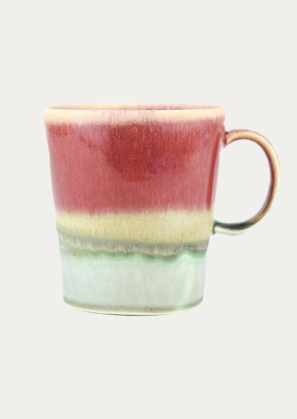 Multicolored ceramic mug with a gradient from red to green on a white background