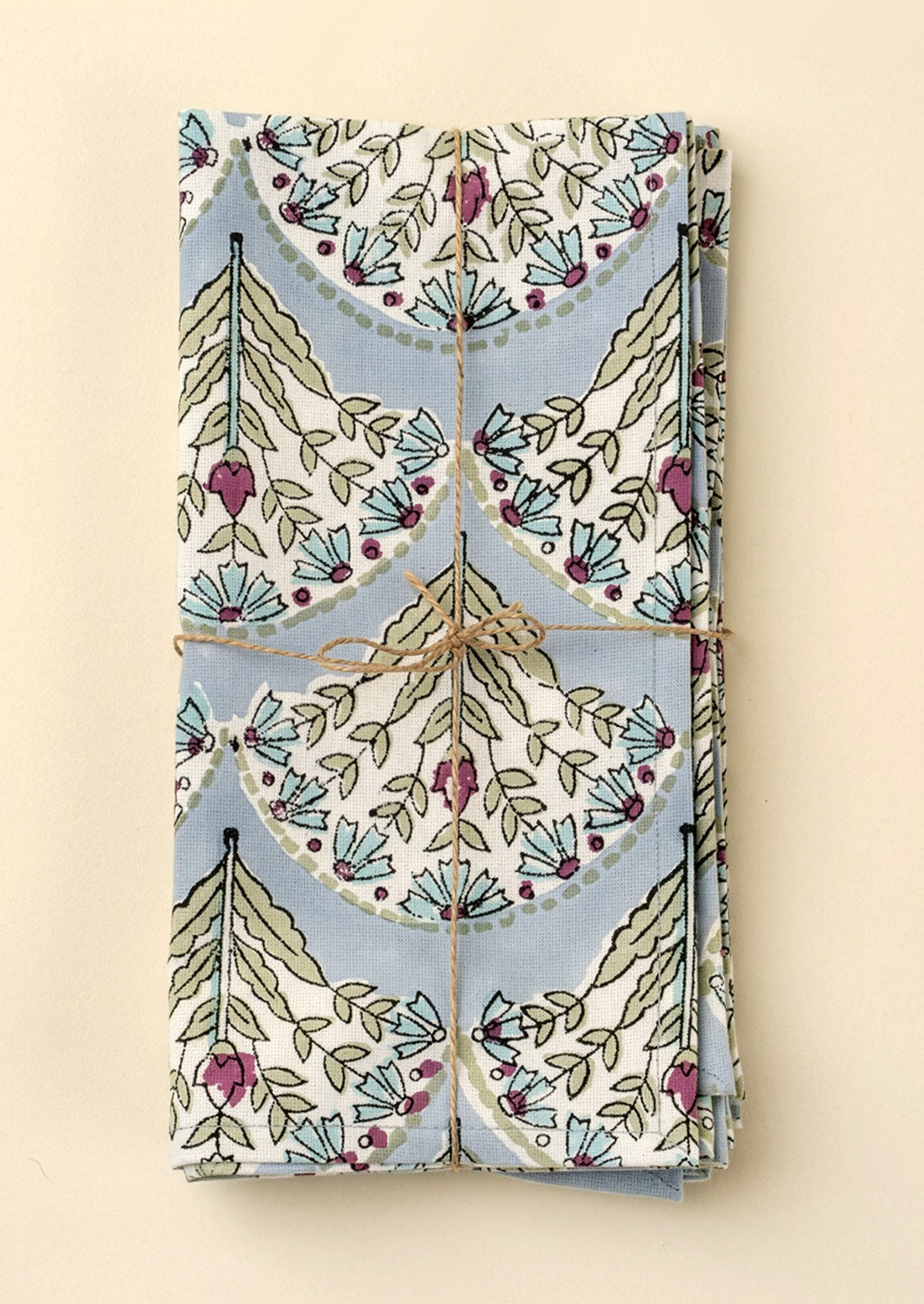 Folded fabric with decorative pattern on a beige background