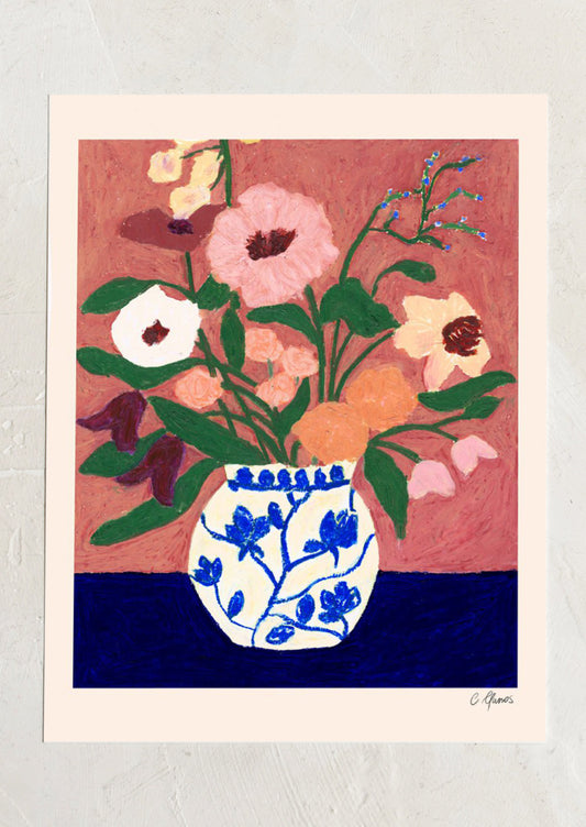 An art print of a painting of flowers in blue and white vase.