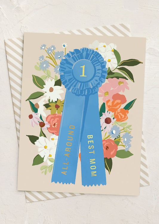 Card with blue ribbon and floral design on a beige background