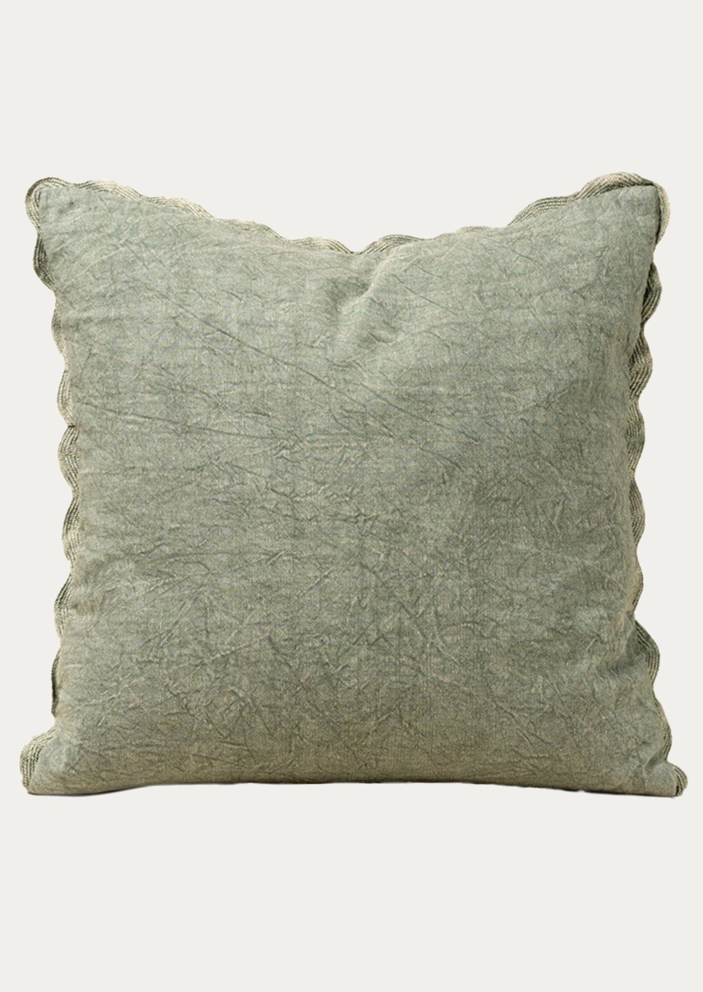 Stonewashed sage green pillow on a white background