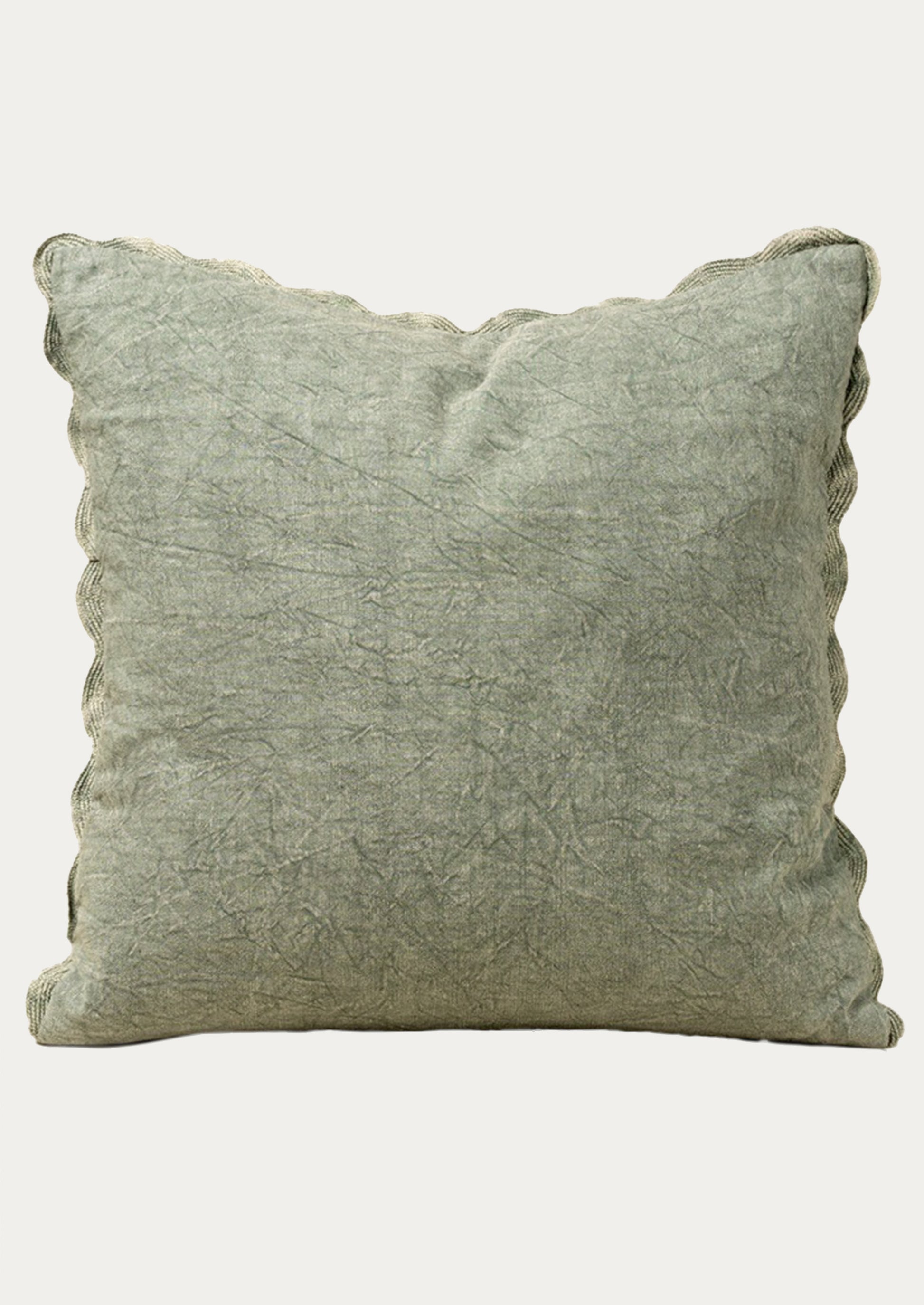 Stonewashed sage green pillow on a white background