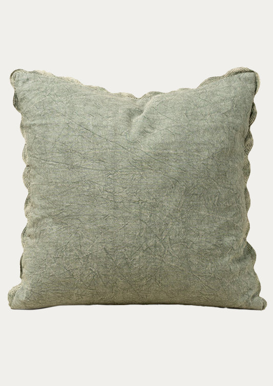Stonewashed sage green pillow on a white background