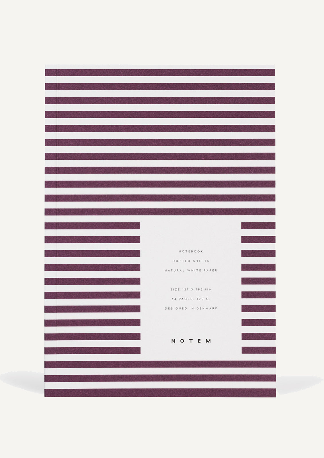 A notebook in white and bordeaux stripes.