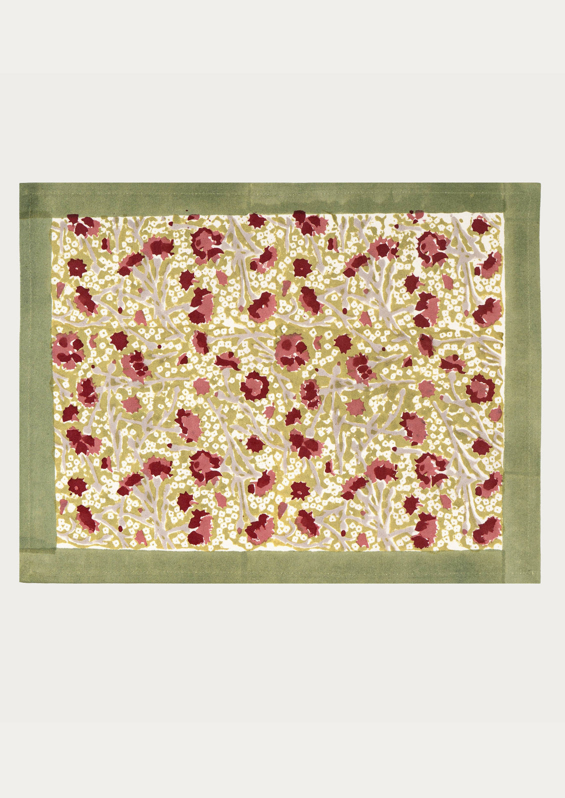 Floral patterned fabric with a green border on a white background