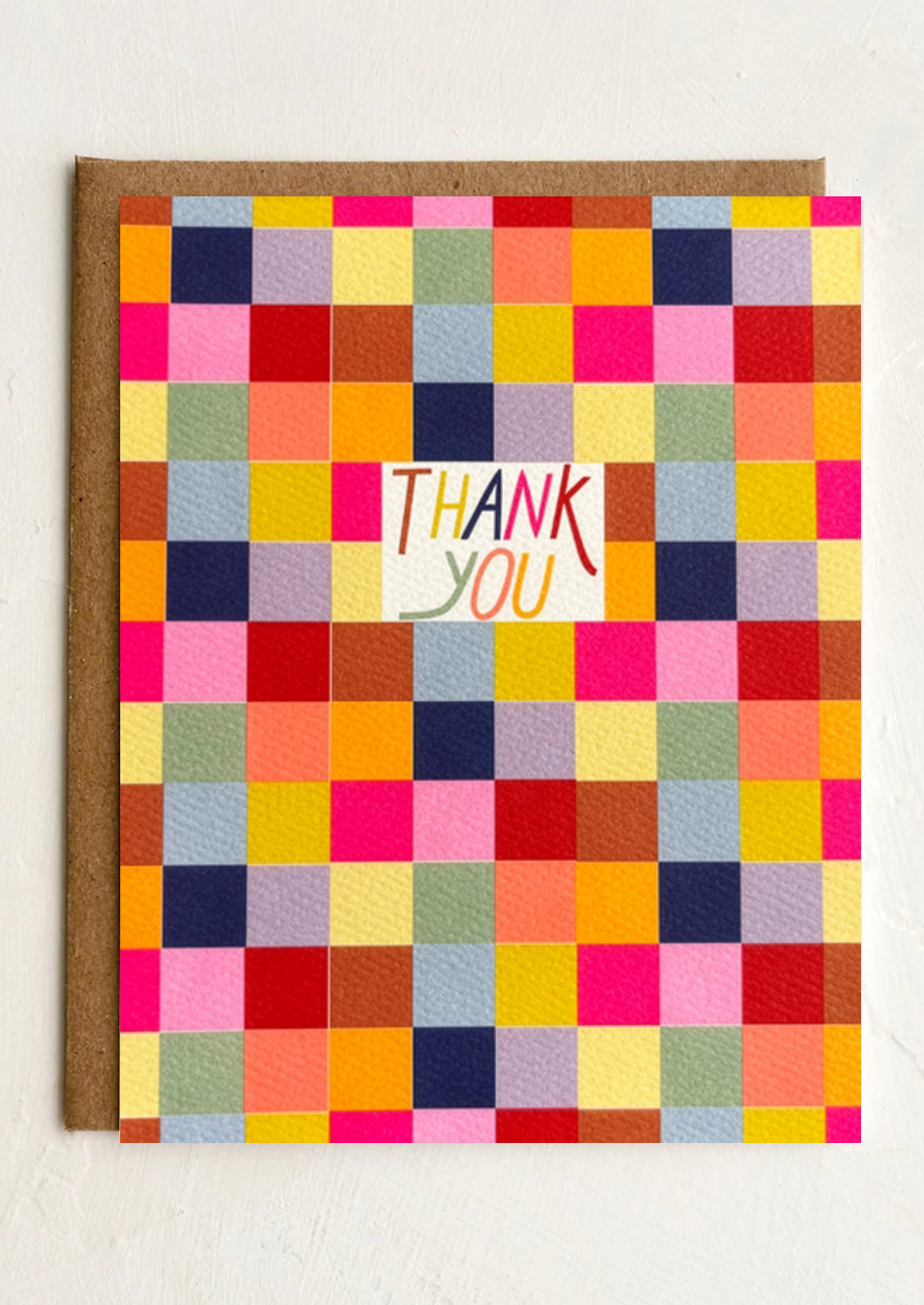 Colorful checkered card with 'Thank You' text on a white background