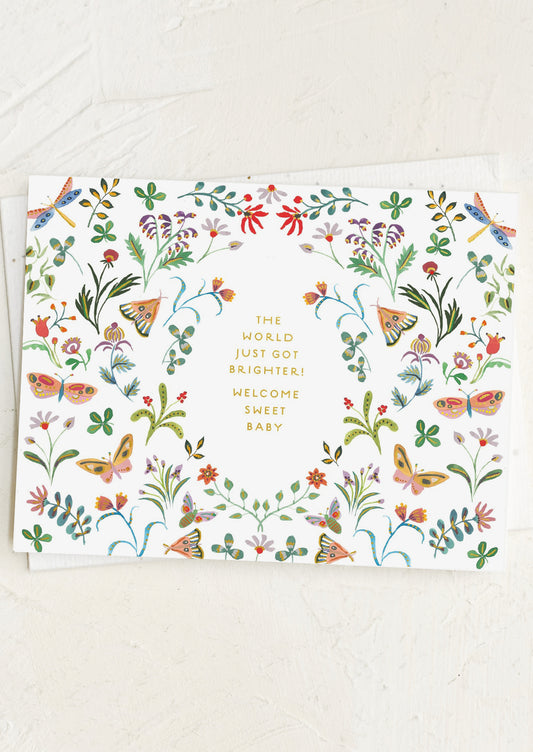 Greeting card with floral design and text on a white background